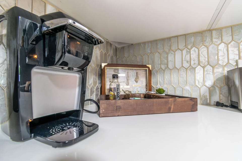 Keurig coffee maker and coffee pods provided.