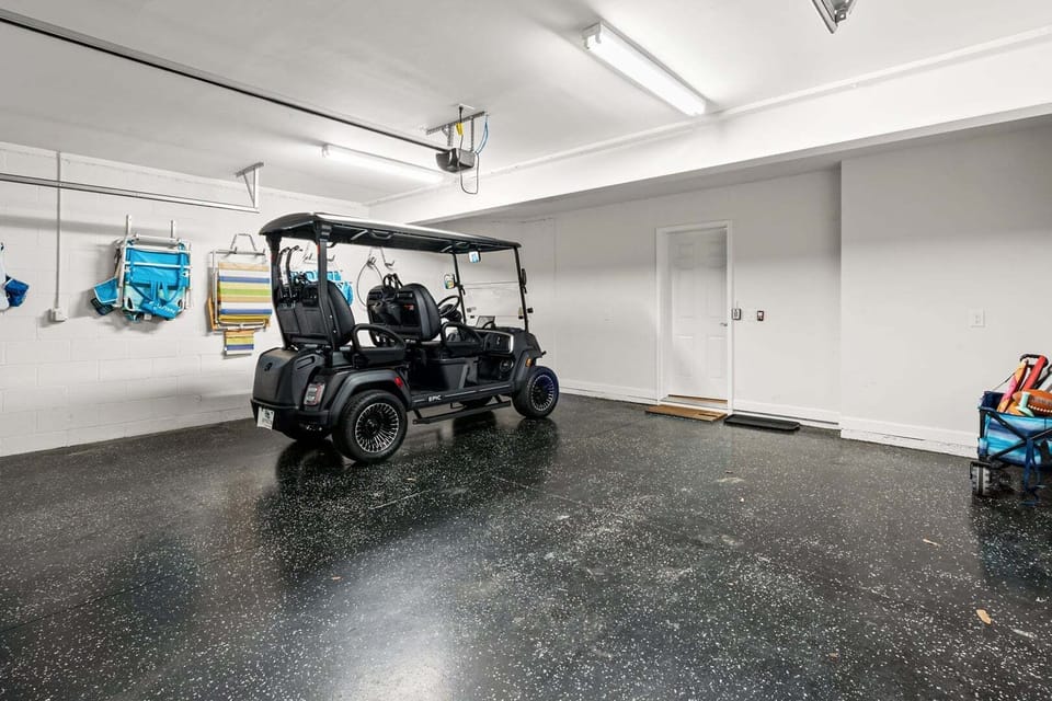 Garage bay with room for a golf cart and gear at Ocean Keyes 1301, Ocean Drive, North Myrtle Beach