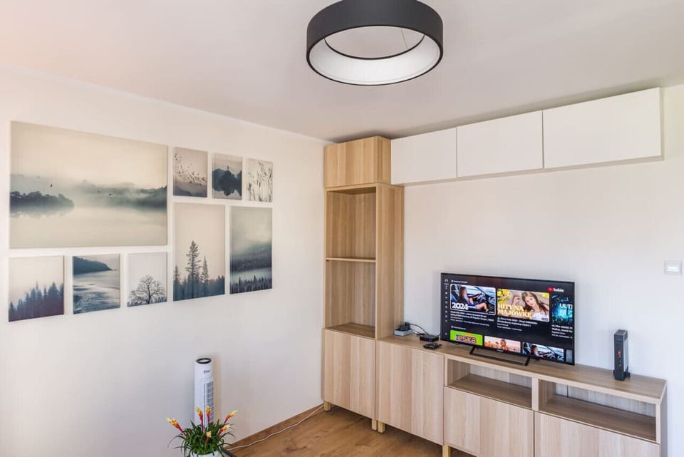 Comfortable Living Room with Sofa Bed and Smart TV | Book Now with RENTUJEMY