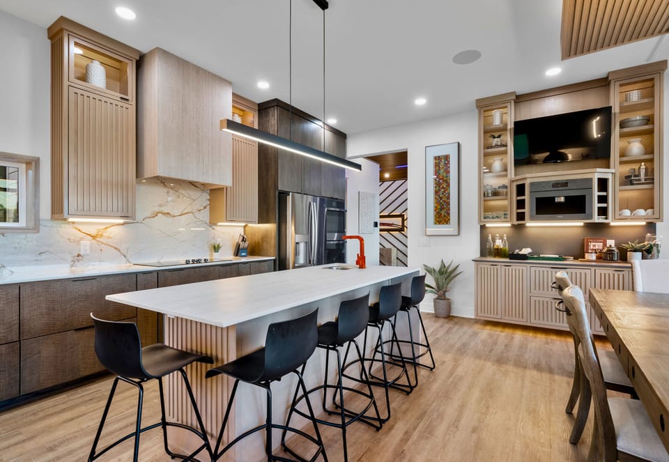 Hip up gourmet meals in this sleek kitchen, designed for chefs and socialites alike. Savor the flavors and the views!