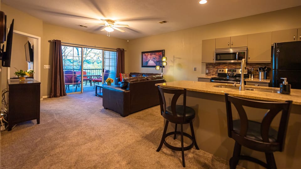 Open floor plan with 65-inch Roku TV.