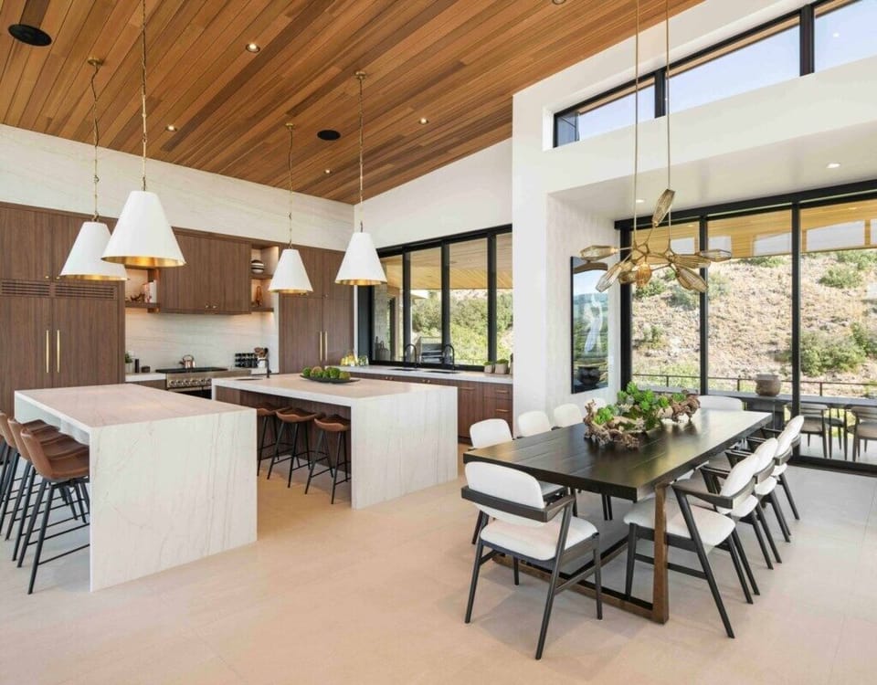Double islands. Prep sink and wine cooler. Table expands for 10 people