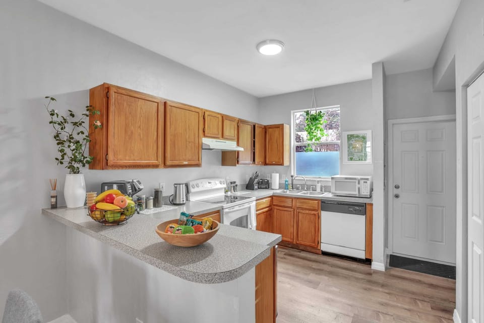 Our open-concept kitchen flows right into the living areas, ensuring you never miss a moment with your group while preparing dinner.