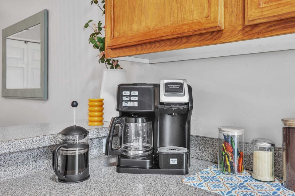 Coffee bar goals! Featuring a versatile Hamilton Beach FlexBrew and a French press, along with assorted teas and sweeteners for your convenience.