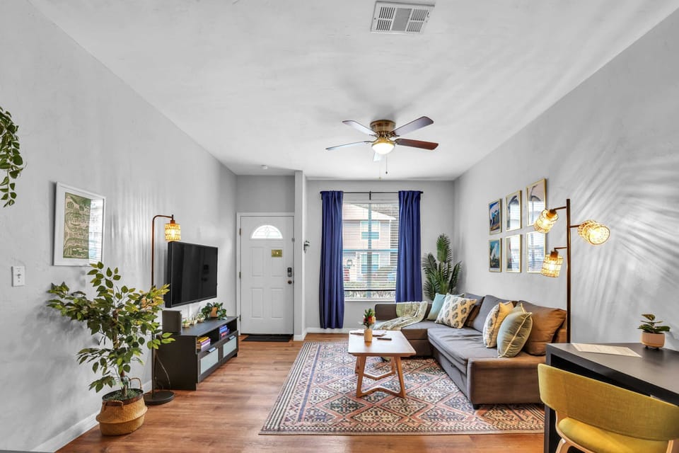 Stay productive and relaxed with our dedicated laptop-friendly workspace, featuring a stylish desk and comfortable seating just steps from the sofa.