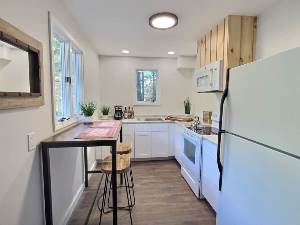 Dining area for shared meals, set in a Vermont retreat with Green Mountain views.