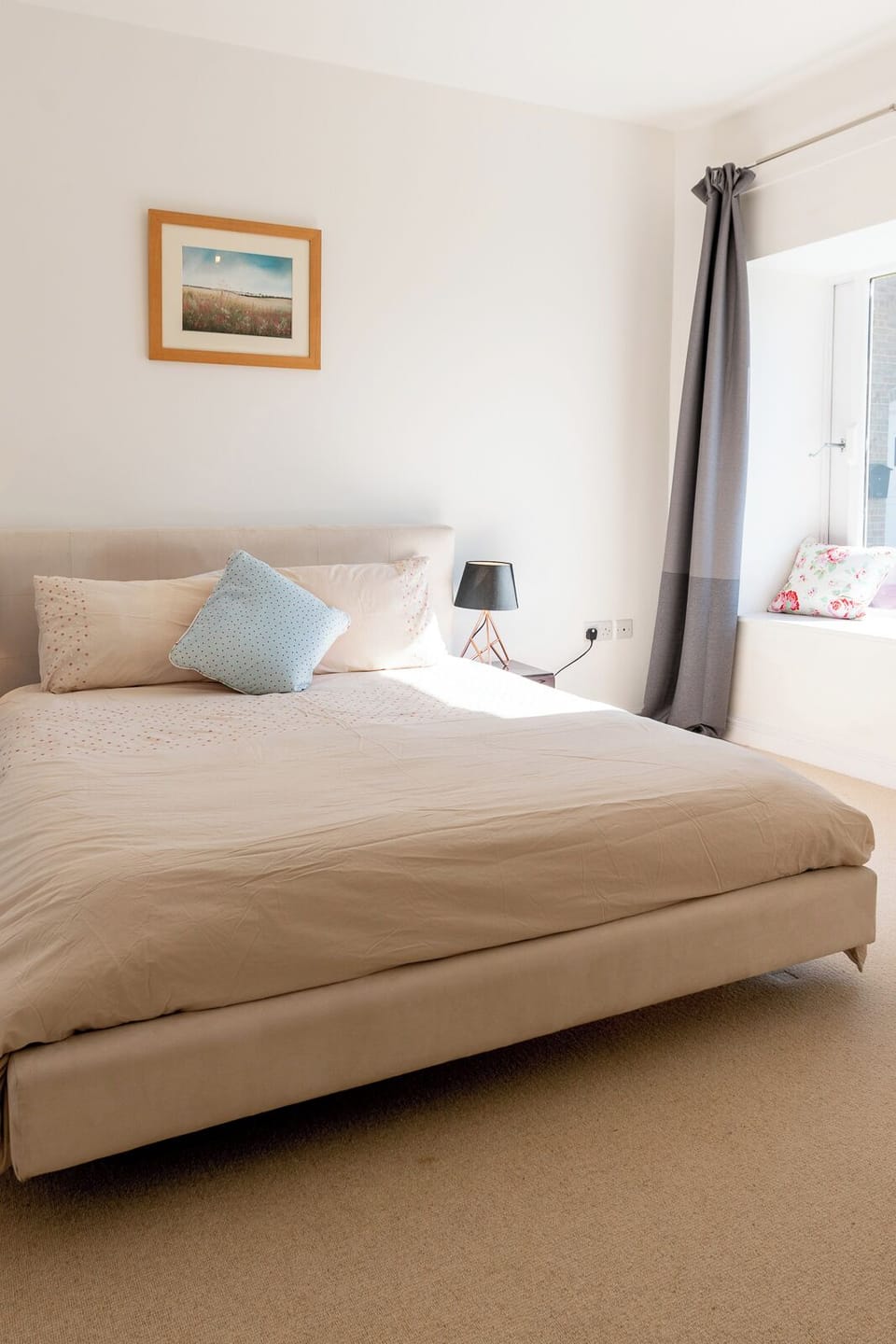 The bedroom looks over countryside and a private lake