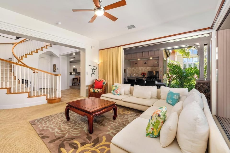 Living room with large windows and garden views