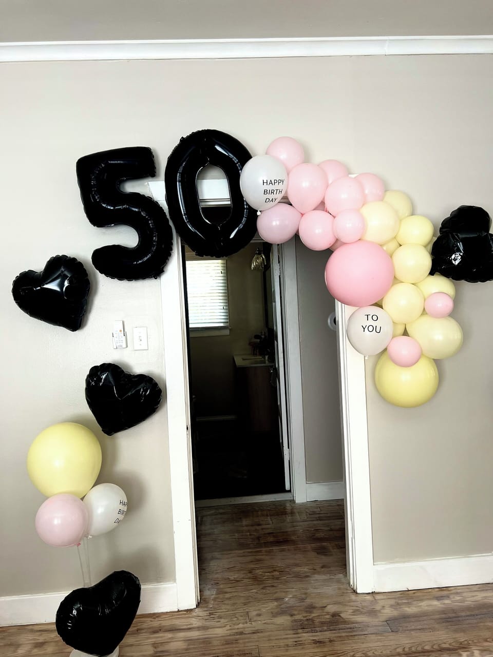 Special event package: balloon arches, cake, champagne, rose petals,letter board