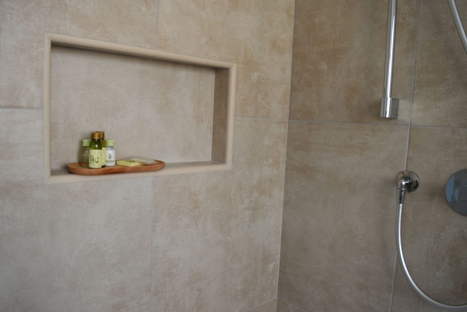 Deluxe Room, City View | Bathroom | Shower, rainfall showerhead, hair dryer, bathrobes