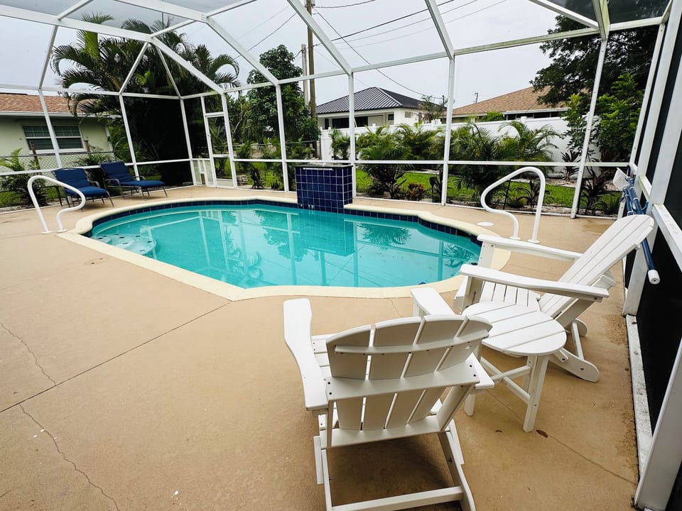 Beautiful heated pool with waterfall and plenty of seating