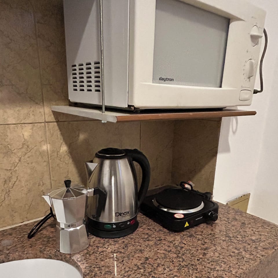 Superior Suite | Private kitchen | Full-size fridge, microwave, cookware/dishes/utensils