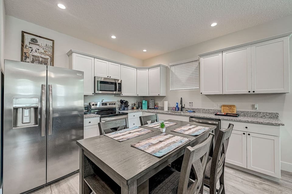 Fully stocked kitchen with keurig, coffee, toaster, dishware, silverware, kids dishware, pots/pans, spices, popcorn, and more