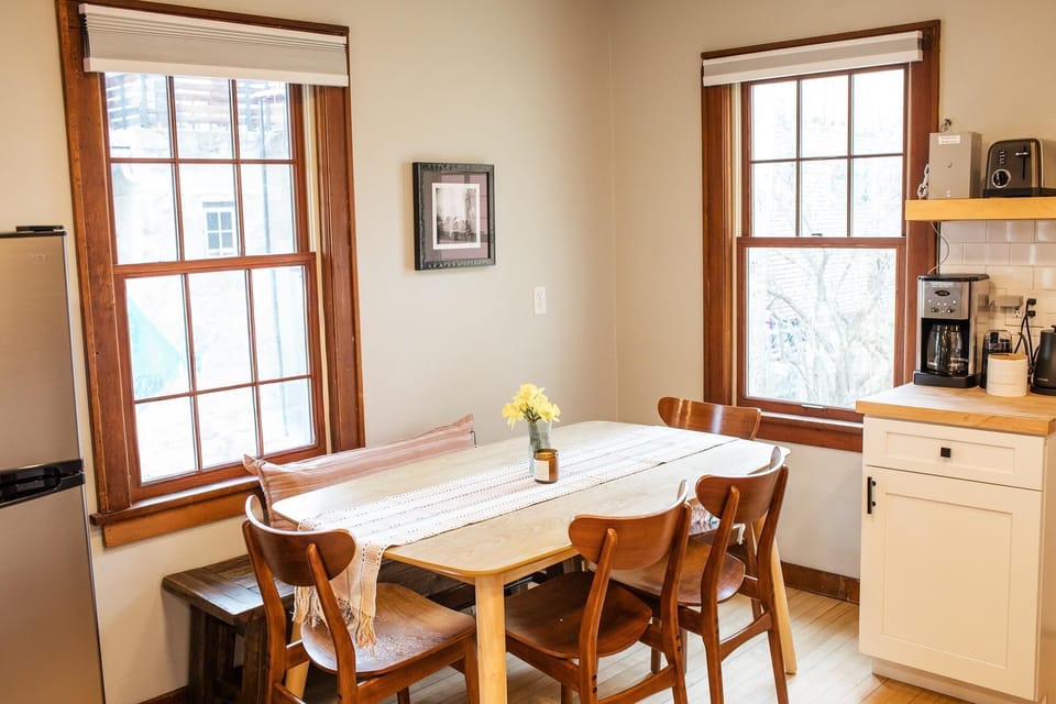 Cozy dining nook with natural light and charming wood accents