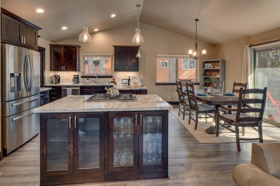 - Gourmet kitchen with granite counters and center island  
- Stainless steel appliances and plenty of prep space  
- Perfect cabin retreat for cooking and family dining