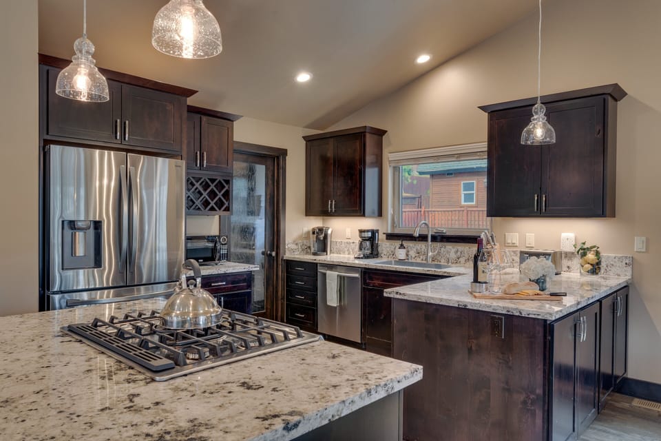- Elegant kitchen design with granite counters and storage  
- Open layout connects to dining and living spaces easily  
- Perfect for cooking and entertaining during your getaway