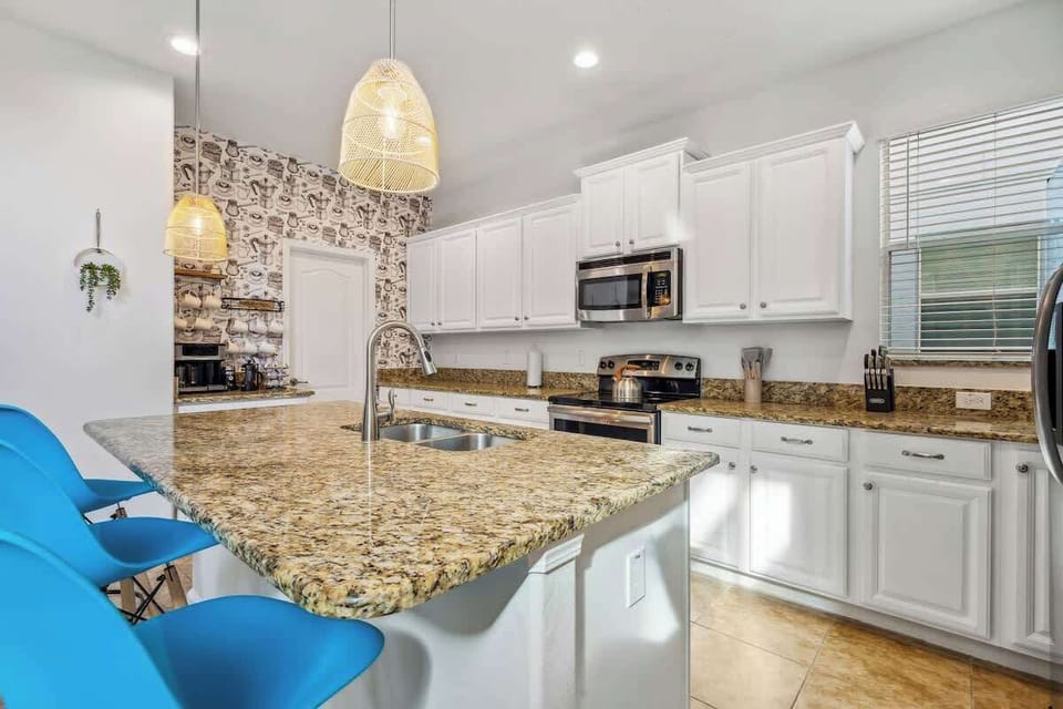 Experience the joy of cooking together in our modern kitchen, a hub for family fun.
