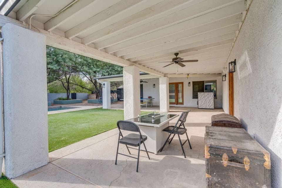 Spacious covered patio with fire table, bar, and ping pong