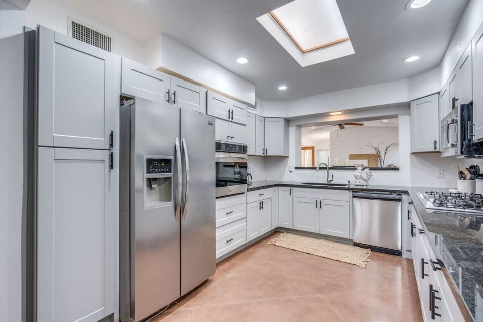 Updated, fully-equipped kitchen with stainless steel appliances