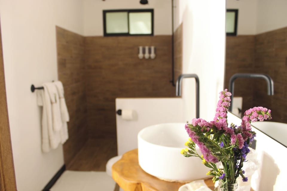 Shower, rainfall showerhead, hair dryer, towels