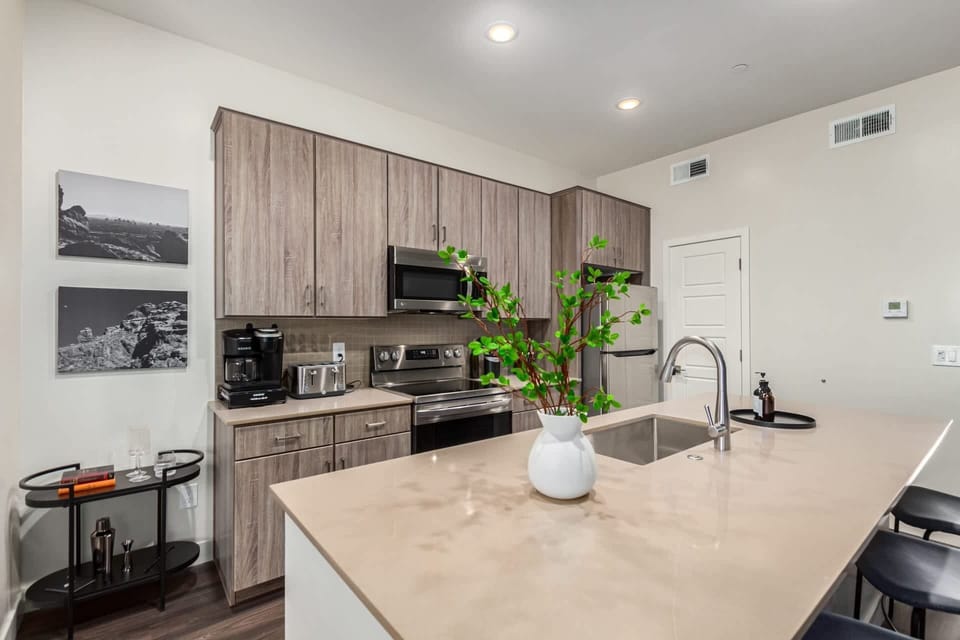 Custom Wood Cabinets, Stainless Steell Appliances and Island Seating