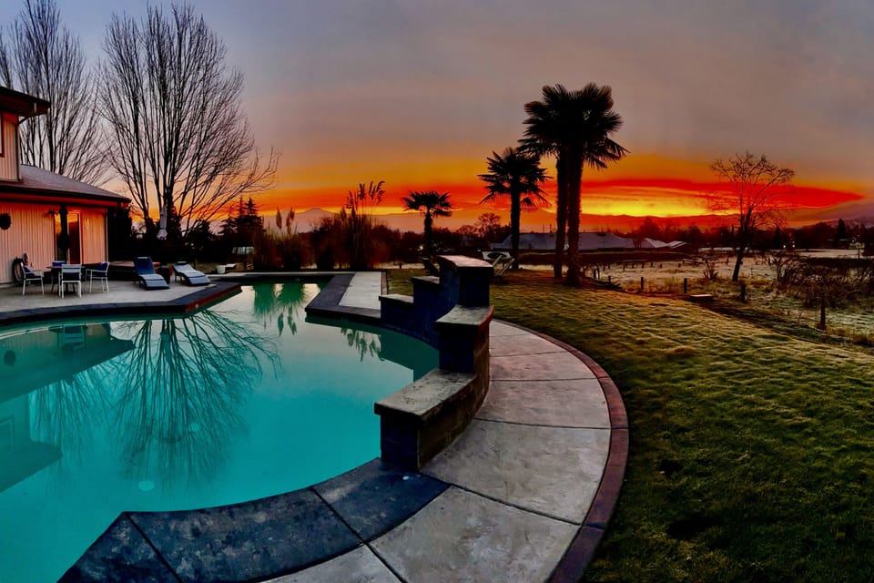 Winter sunsets from the pool deck — hot tub and sauna are open year-round.