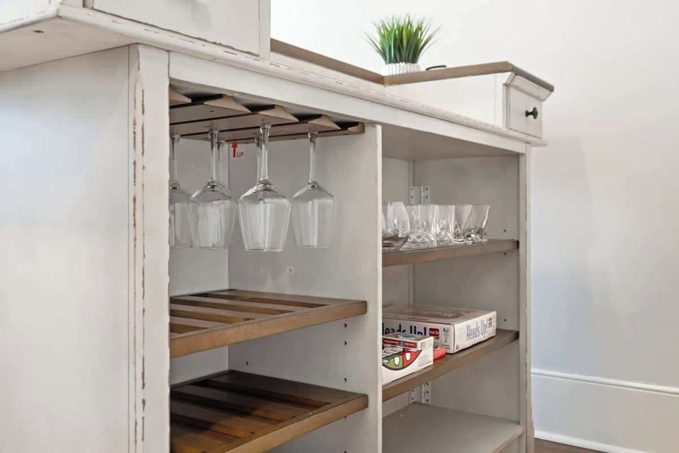 Living Room Bar with Wine and Whiskey Glasses - Games in Shelves