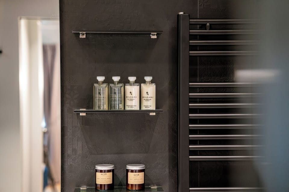 Deluxe Room, City View | Bathroom | Shower, rainfall showerhead, hair dryer, bathrobes