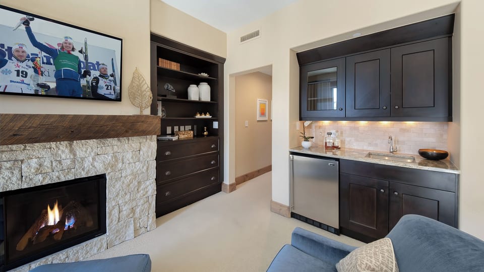 Bedroom 1, Main Level - Primary suite with fireplace and mini bar