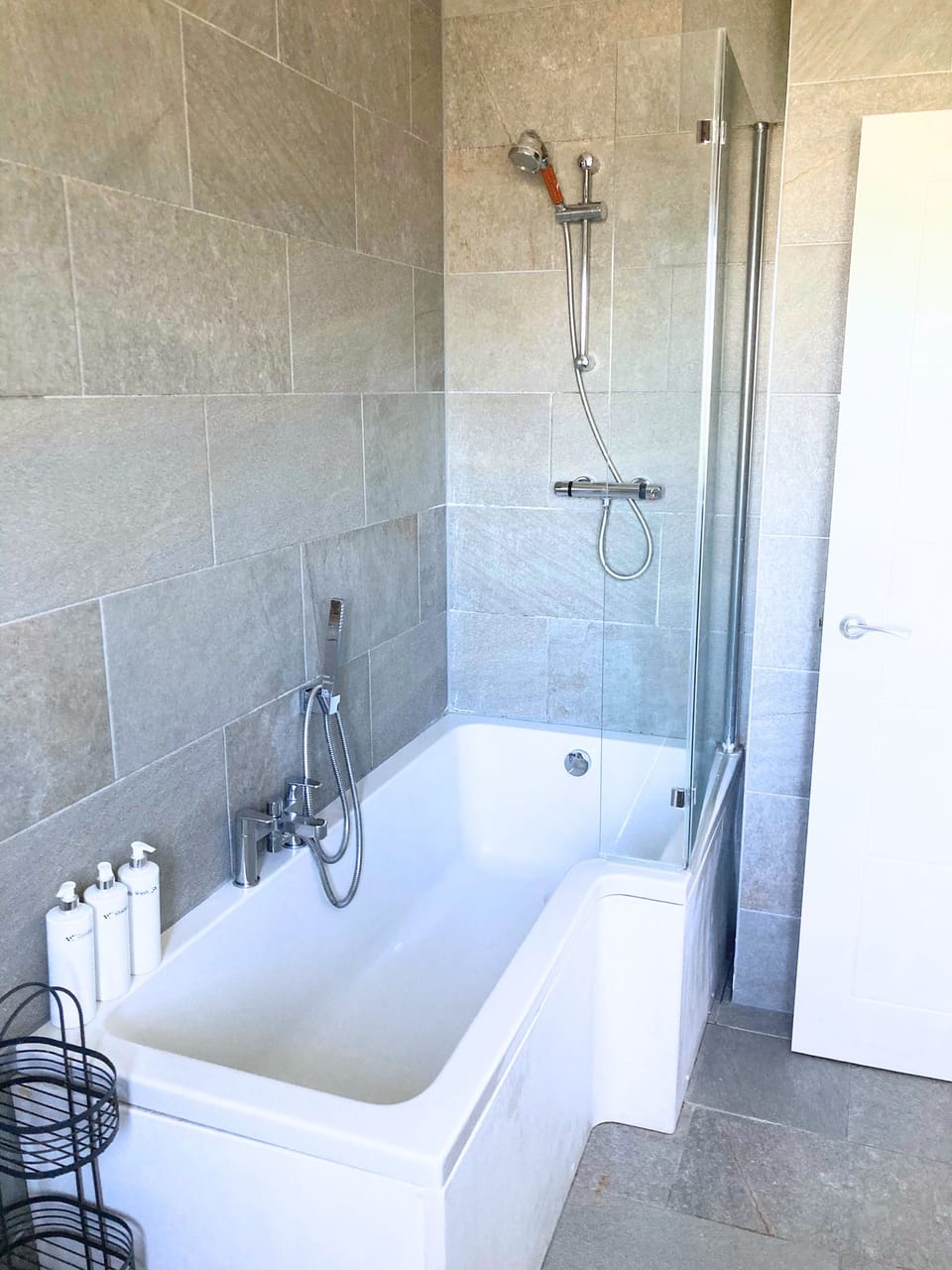 Family bathroom with bathtub and shower