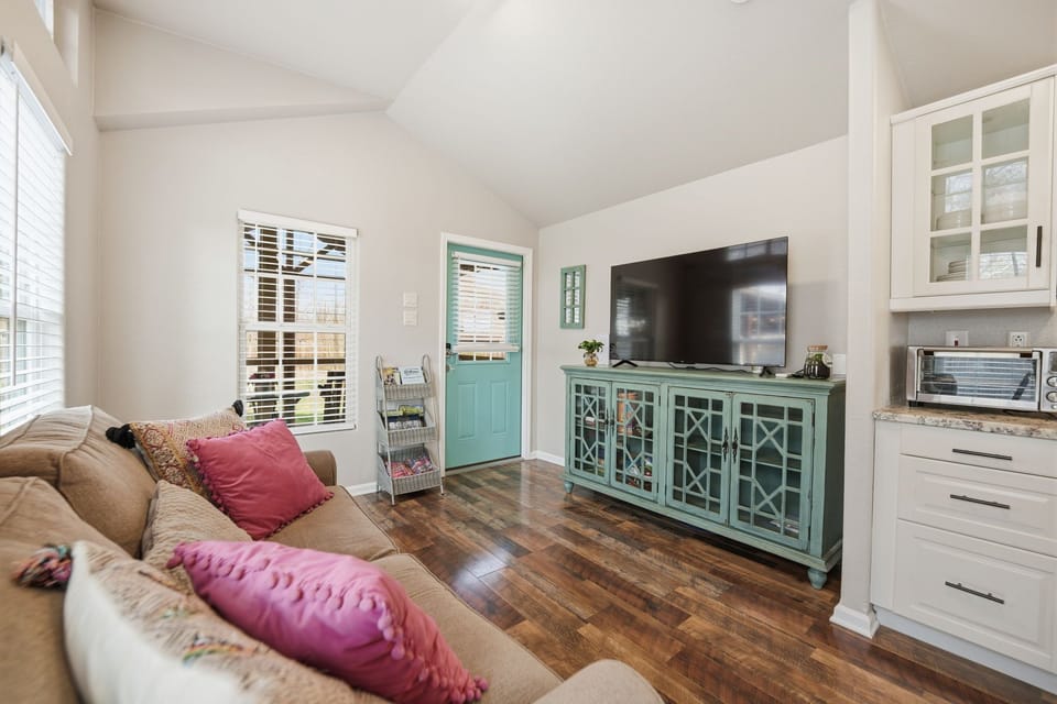 An inviting living room with cozy seating, Smart TV, and warm natural light that makes your stay in New Braunfels feel just like home.