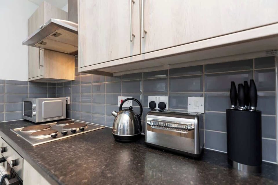 With all the necessary amenities, including a washing machine, this kitchen is ready for your culinary adventures and everyday needs