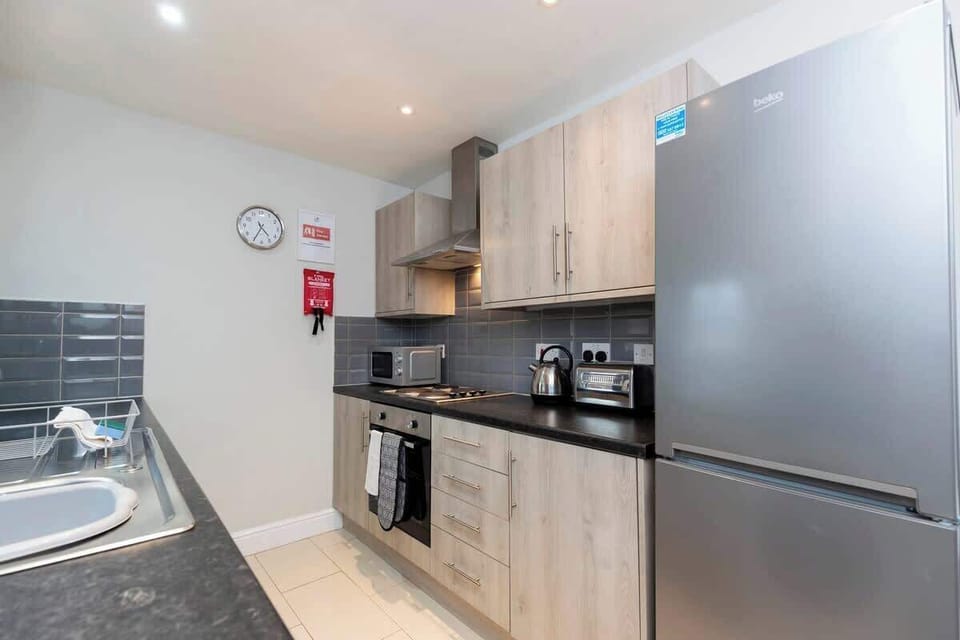 With all the necessary amenities, including a washing machine, this kitchen is ready for your culinary adventures and everyday needs