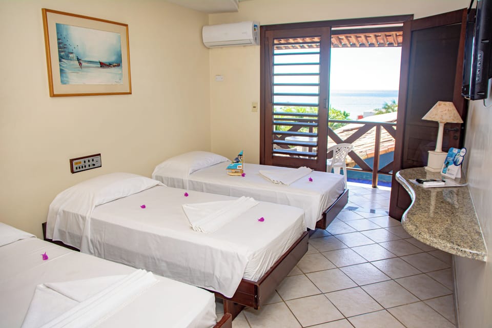 Luxury Triple Room, Pool View | In-room safe, blackout drapes, iron/ironing board, free WiFi