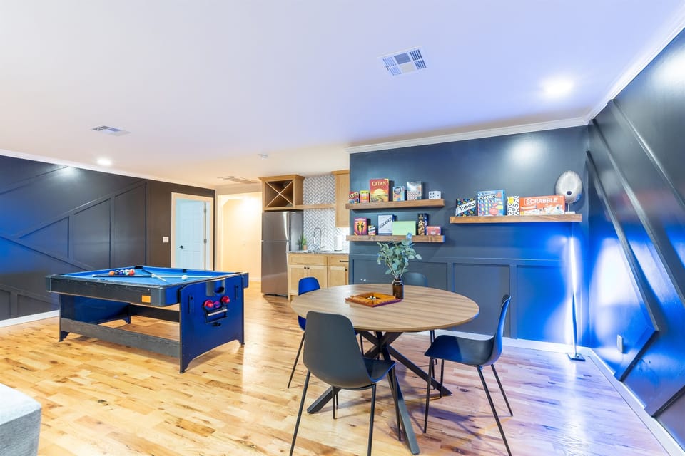 Game room - Equipped with 6 arcade machines, pool/air hockey table, game table with over 15 board games, dining/meeting table & benches and an 85-inch TV.