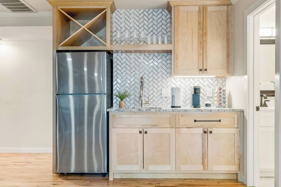 Upstairs kitchenette - Make your snacks for movie time! Small refrigerator, Keurig coffee maker and full size kitchen sink. 