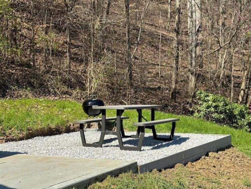 Fire up the charcoal grill and enjoy a meal at the picnic table!