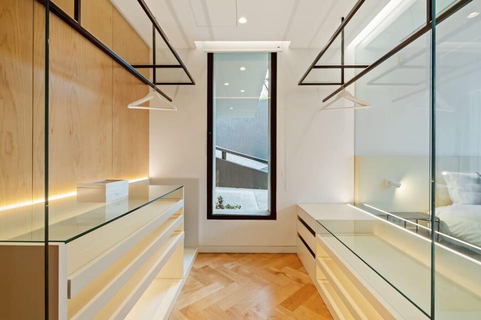 Elegant walk-in wardrobe with natural light.