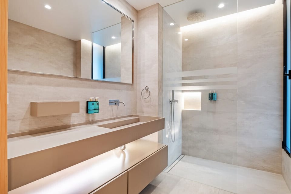 Walk-in shower with floating vanity
