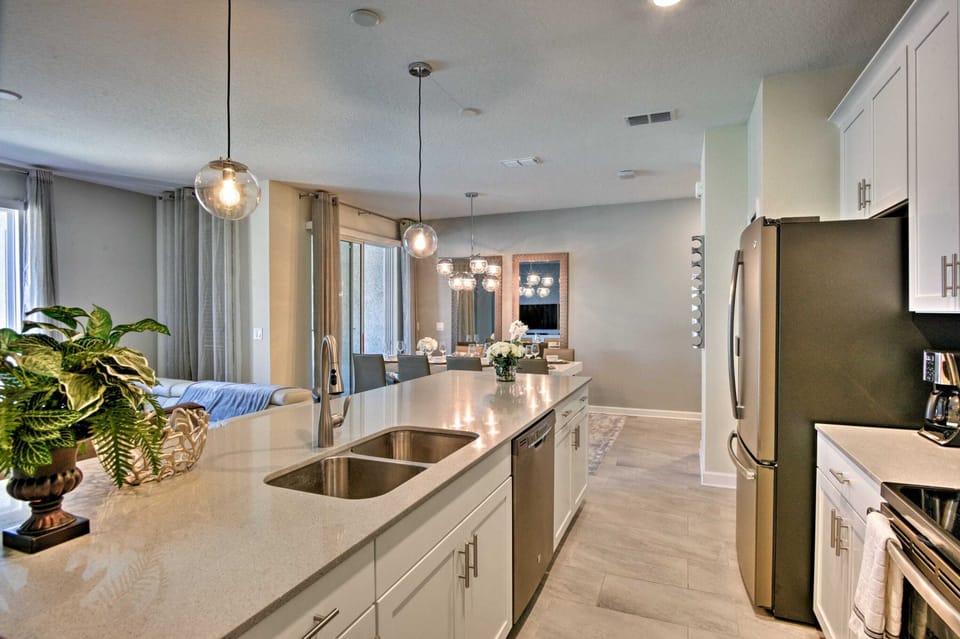 The fully equipped kitchen features modern, stainless steel appliances and includes all dining and cooking essentials.