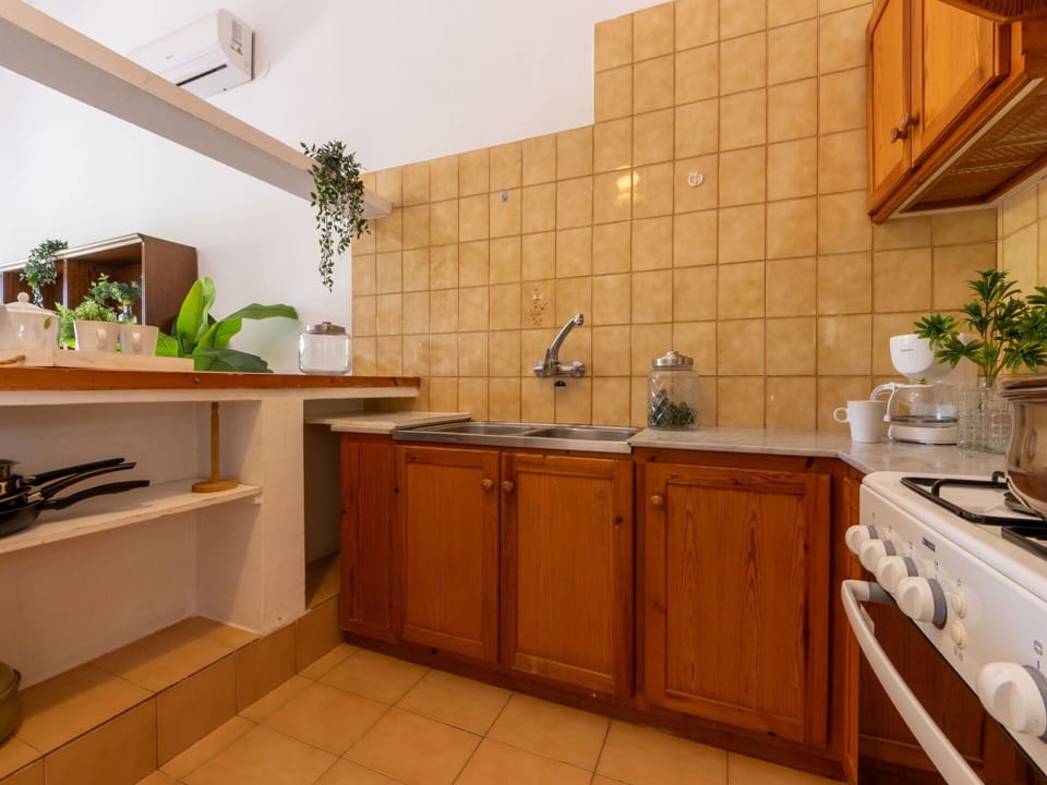 Kitchen, Countertop, Wood, Kitchen Appliance, Flooring, Interior Design, Furniture, Major Appliance, Cabinetry, Floor