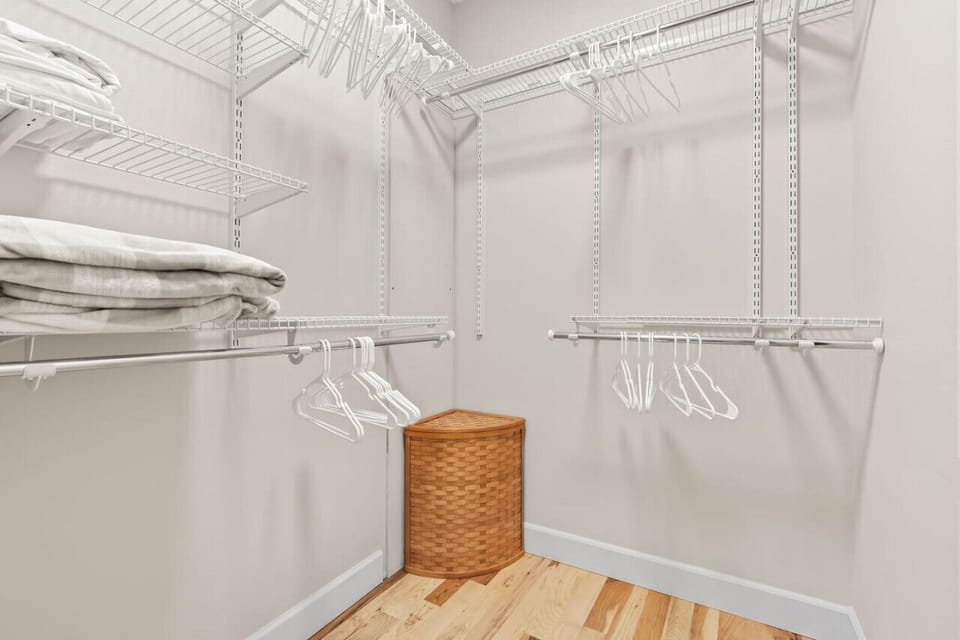 Primary bedroom`s large walk-in closet.