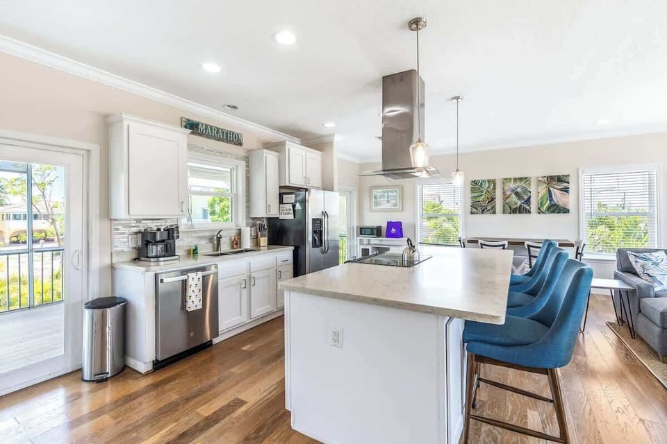 Kitchen with kitchen island and stainless appliances, island has bar seating 