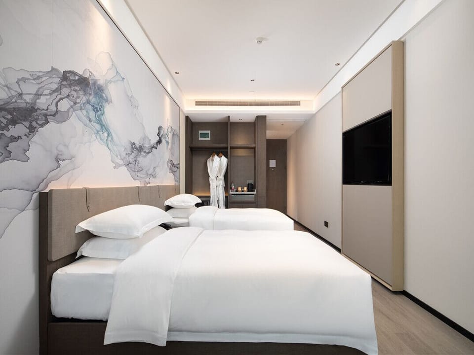 Classic Twin Room | Down comforters, minibar, in-room safe, blackout drapes