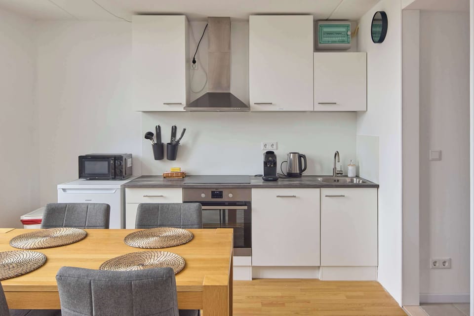 Compact kitchen with everything needed for cooking and relaxing at home.