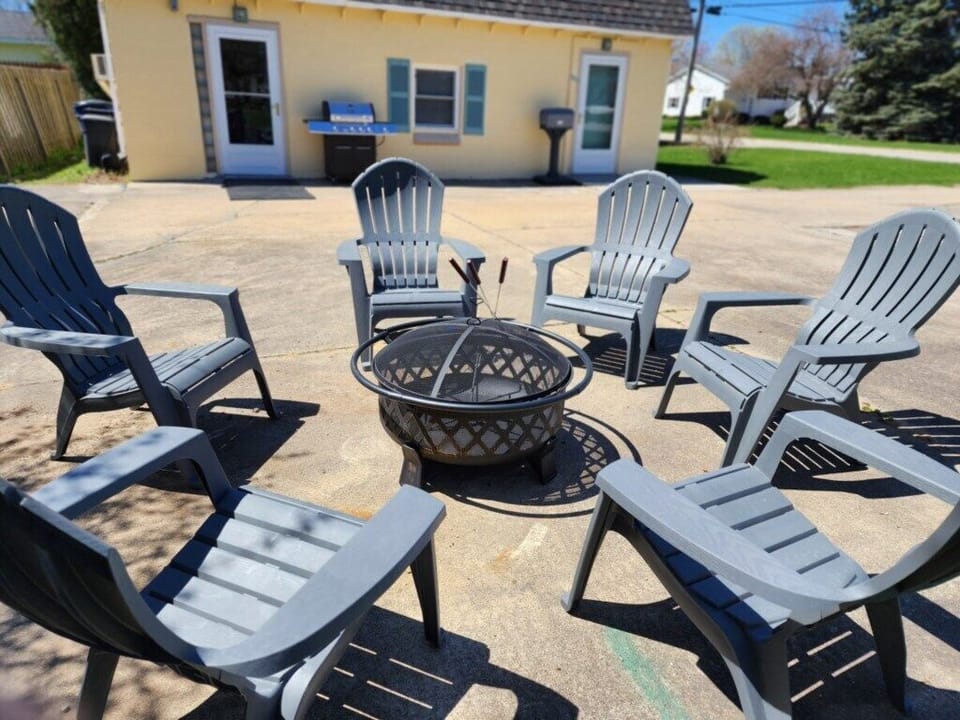 Fire pit with seating and a picnic table.