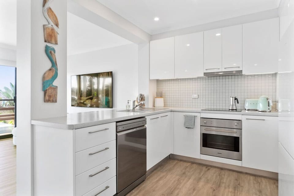 Downstairs - Modern kitchen fully equipped with high end utensils and every thing you need to cook meals.Has a dishwasher and a large fridge/freezer.