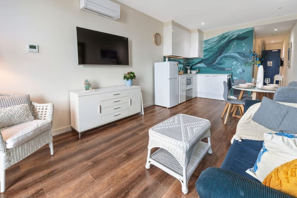 Open plan lounge TV space, with air-conditioning