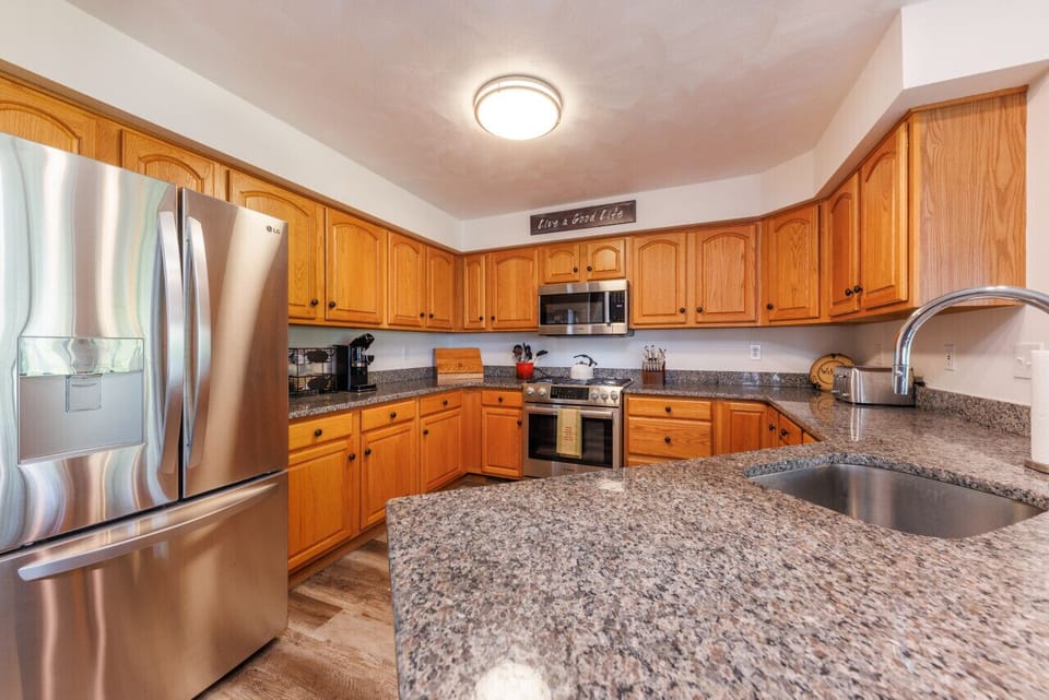 The chef's kitchen is the perfect place to cook delicious meals and entertain your guests. Equipped with top-of-the-line appliances and ample counter space, it makes meal preparation a delightful experience.
