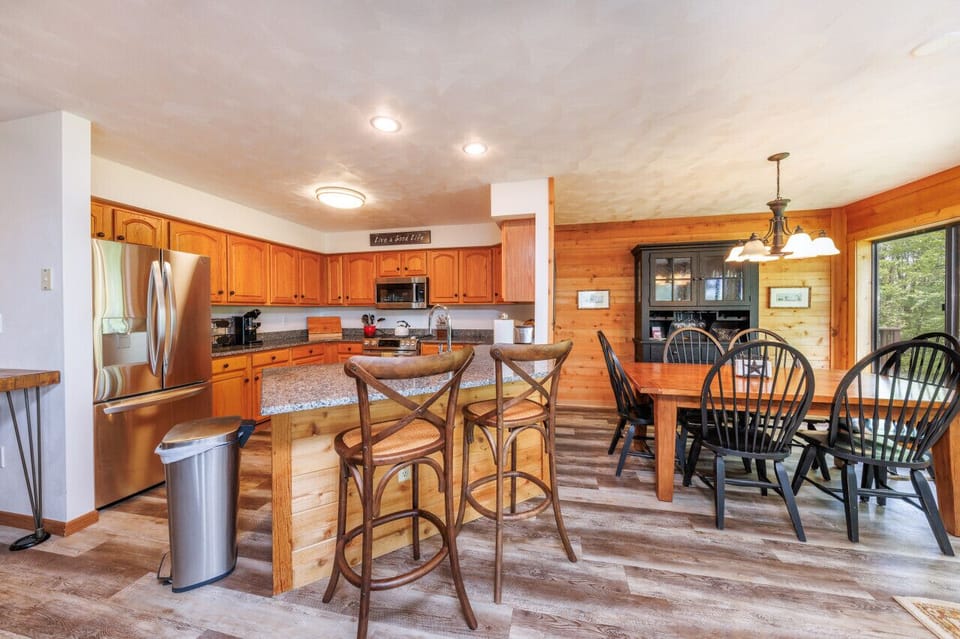 Enjoy the open concept floor plan, perfect for guests to reconnect and create lasting memories together. The spacious layout allows for easy interaction and a comfortable flow throughout the living areas.